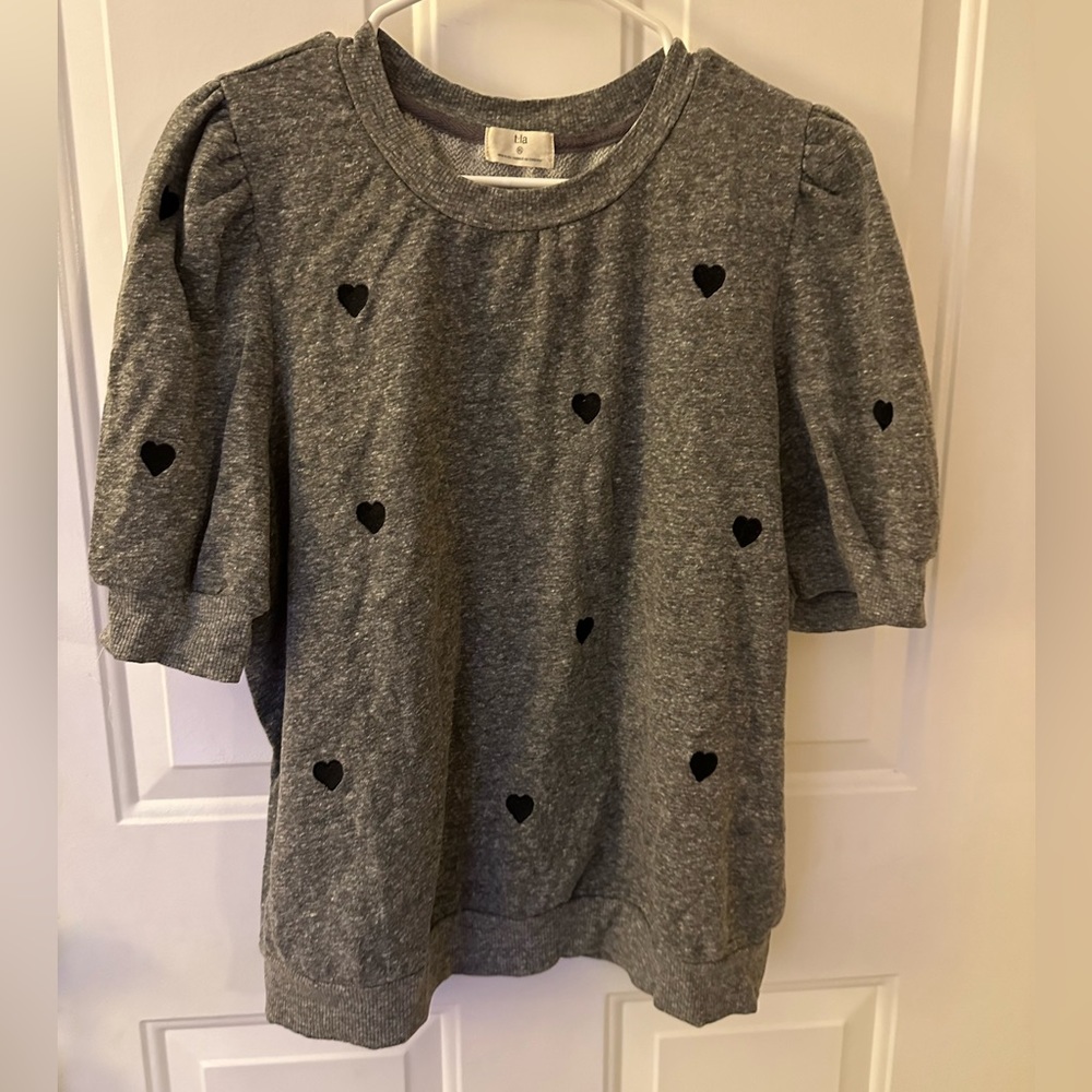 Cute short sleeve sweatshirt with embroidered hearts.
